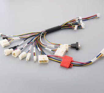 Why are wire harnesses necessary for a car?